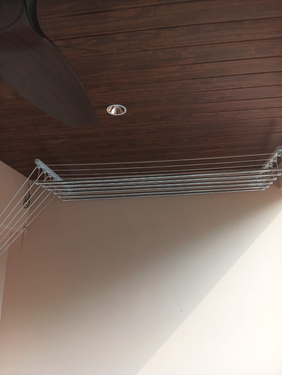 Apartment balcony requiring a space saving cloth hanger